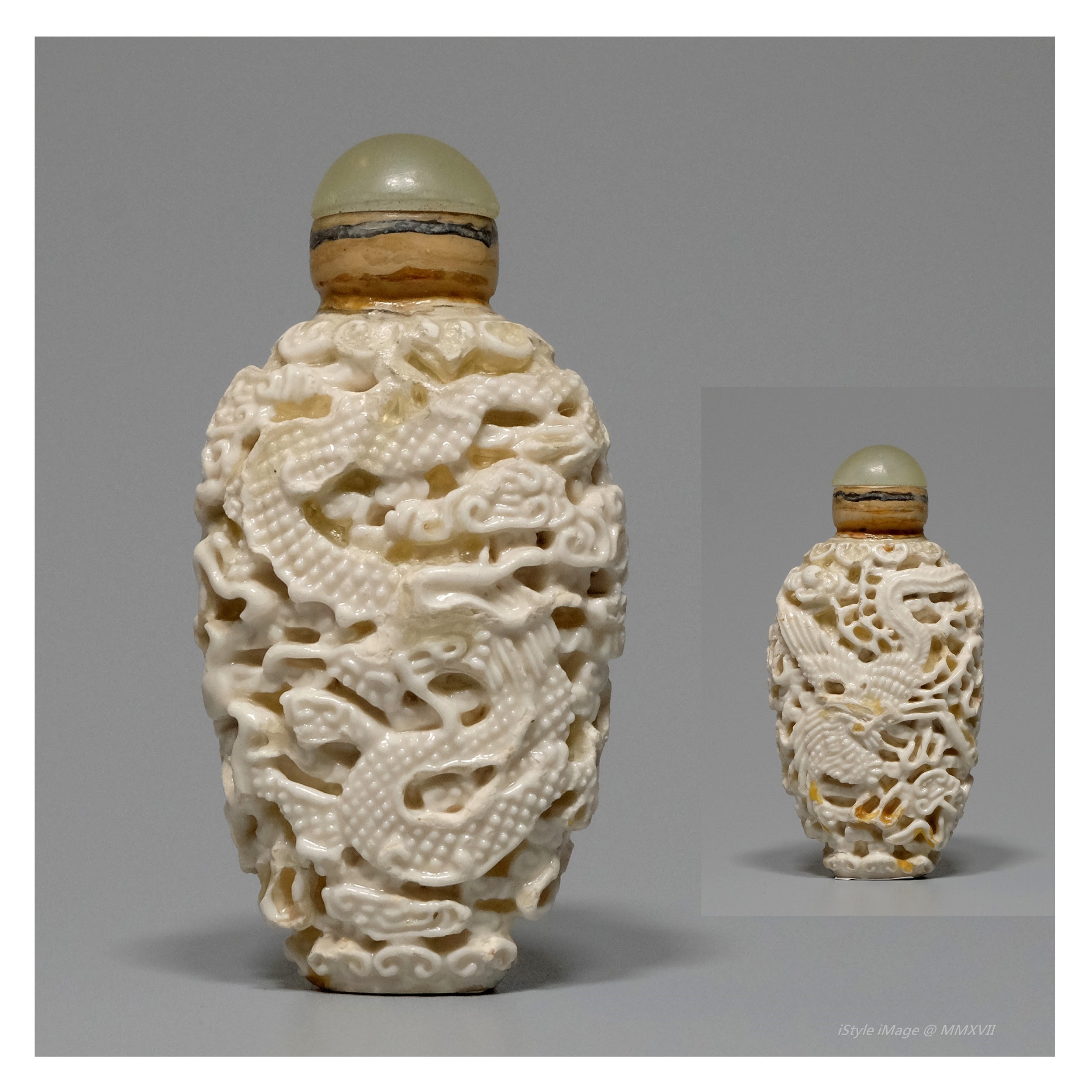 <br><h4>Lot 111 : A finely carved ivory-glazed 'dragon and phoenix' snuff bottle ( Republic period )</h4>
							This finely carved bottle with ivory glazed, the inner in continuous clouds, the exterior carved in high relief, with a pair of dancing dragon and phoenix amidst fiery clouds, full of happiness and peace. With moon stone stoppers, and spoon. 
							<br>Measurements (H) high 7.2 CM,  (W)width 3.6CM<br><br><br>精美雕刻的象牙釉 '龍鳳' 煙壺  ( 民國時期 )<br>這精美雕刻的象牙釉煙壺，內雕連續的雲，外面玲瓏浮雕，雕刻著一對龍鳳在火雲之間飛舞，充滿喜樂平和。 配月光石塞和勺子。<br>尺寸(H)高 7.2 厘米, (W)濶 3.6 厘米