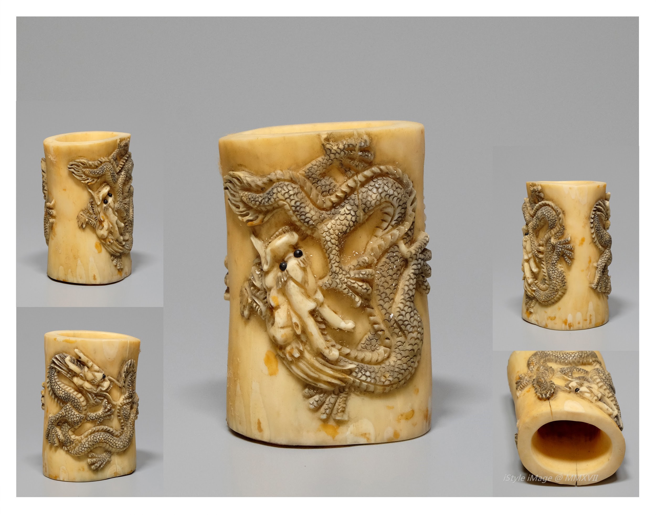 <br><h4>Lot 44 : A very well carved ivory dragons brush-holder 50's last century (imperfection on brush-holder cylinder)</h4>
							The semi translucency ivory skillfully carved a pair of energy ferocious dragons amongst fire scrolls.
							<br>Measurements (H) high 6.5CM, (T) thick 3.8CM, (W)width 4.5 CM<br><br><br>做形巧究的象牙筆筒  ( 上世紀五十年代 )  [有瑕玼]<br>半透明象牙，巧妙地雕一雙充滿能量、生猛的騰龍暢游火軸之間。<br>尺寸(H)高 6.5 厘米, (T)深3.8 厘米 ,  (W)濶4.5 厘米