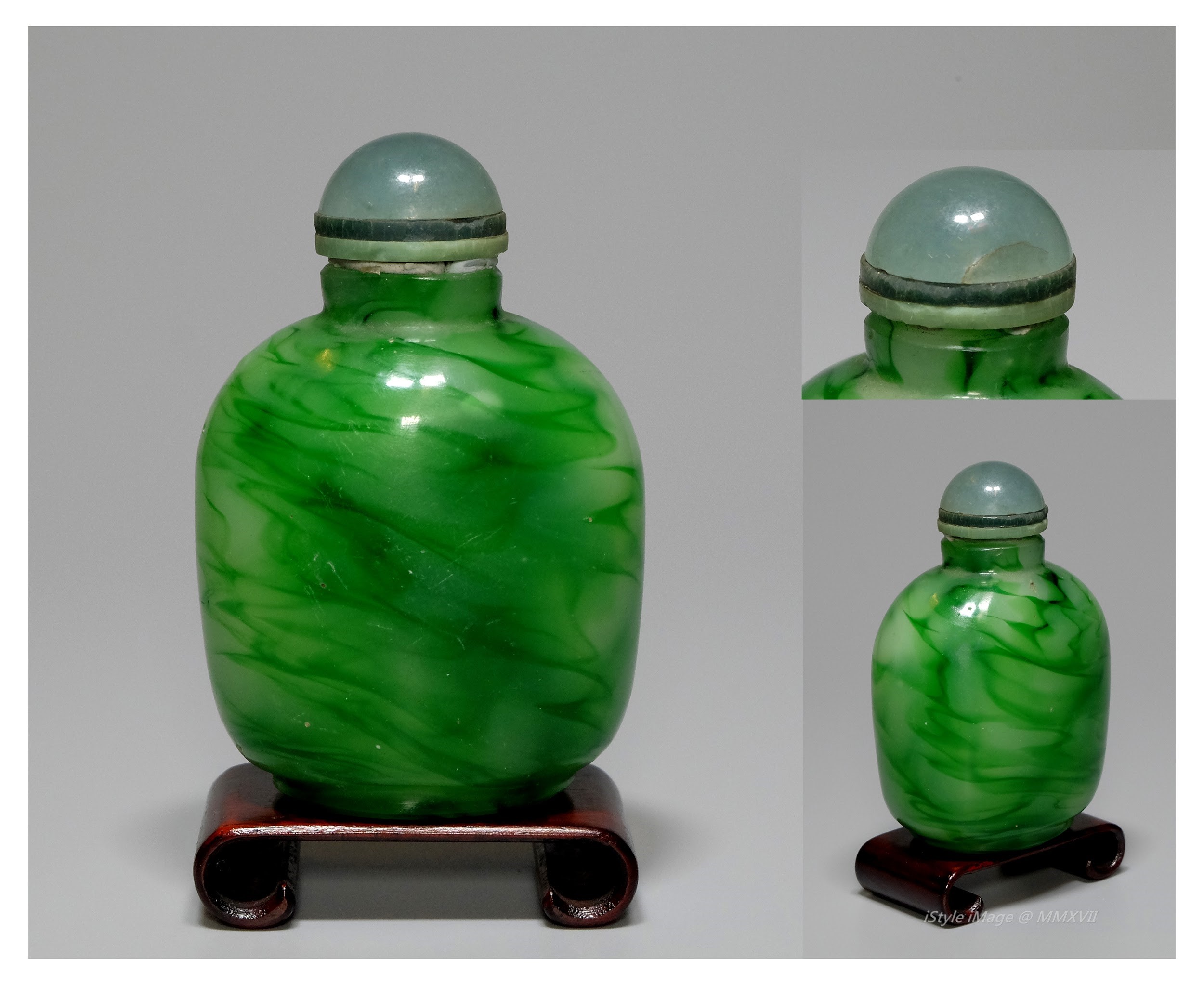 <br><h4>Lot 71 : A charming green jelly glass snuff bottle  ( Republic period )</h4>
							A globular bottle streaked with the green jelly glass body, with brownish green stopper, and spoon.
							<br>Measurements (H) high 7.5 CM, (T) thick 3.5 CM, (W)width 5 CM<br><br><br>迷人的綠色果凍玻璃煙壺 ( 民國時期 )<br>綠色果凍形像的玻璃球體瓶子，配棕綠色的塞勺子。<br>尺寸(H)高7.5 厘米, (T)深 3.5 厘米, (W)濶5 厘米