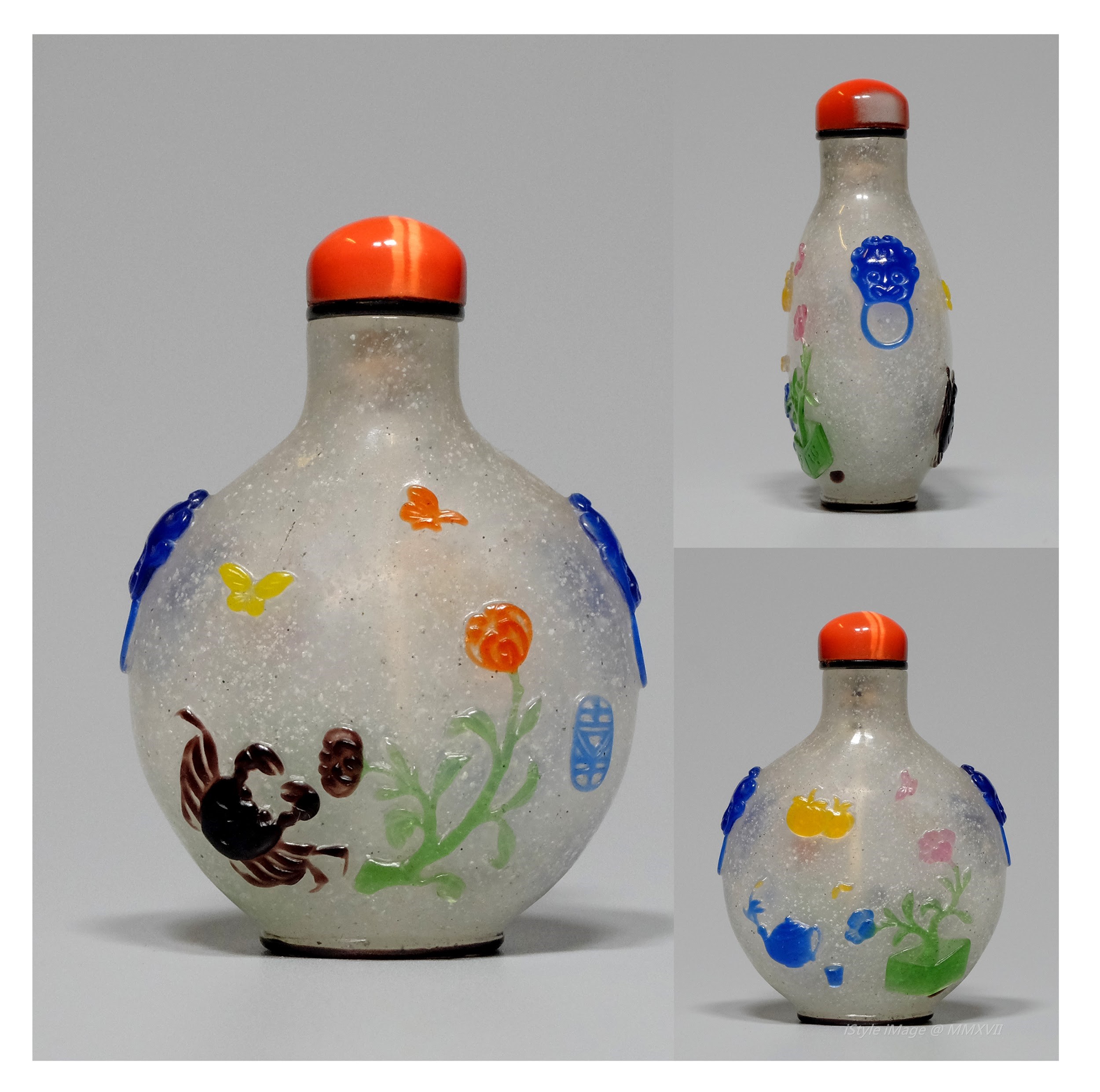 <br><h4>Lot 86 : A rare overlay glass snuff bottle  ( Qing dynasty )</h4>
							Beautiful blue, pink, yellow colour dancing butterflies over the flowers on green stem, with brown colour crab in underwater overlay bottle.  With coral colour cat's eye glass stopper, and spoon.
							<br>Measurements (H) high 6CM, (T) thick 2CM, (W)width 4.5CM<br><br><br>罕見彩料玻璃煙壺  ( 清朝 )<br>美麗的藍色，粉紅色，黃色的蝴蝶在綠色的莖上的花朵上，棕色螃蟹在水下。配珊瑚色貓眼玻璃塞子和勺子。<br>尺寸(H)高 6 厘米, (T)深 2 厘米, (W)濶4.5 厘米