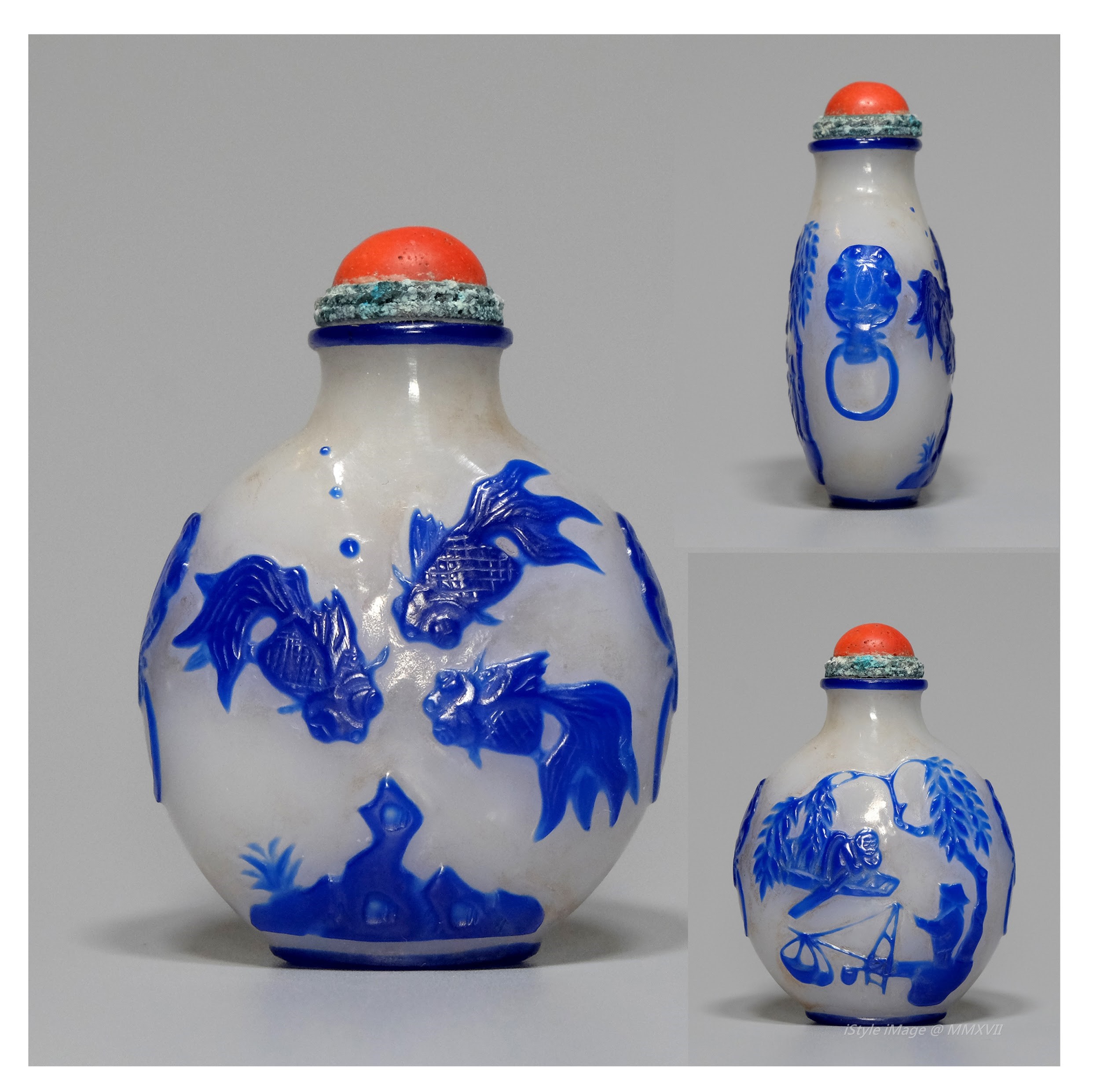 <br><h4>Lot 87 : Elegant blue overlay glass snuff bottle  ( Qing dynasty )</h4>
							A globular bottle carved with three fishes depicted above the riverbed on one side, and carved with a fishman and boat on another side. With red colour glass stopper, brass rim had rusted, and spoon.
							<br>Measurements (H) high 6.3CM, (T) thick 2CM, (W)width 4.5CM<br><br><br>優雅白地藍料玻璃煙壺 ( 清朝 )<br>圓形壺，一面有三條魚在河床上方，另一面是漁夫和漁船浮雕。配紅色玻璃塞和勺子，黃銅邊緣生鏽。<br>尺寸(H)高 6.3 厘米, (T)深 2 厘米, (W)濶4.5 厘米