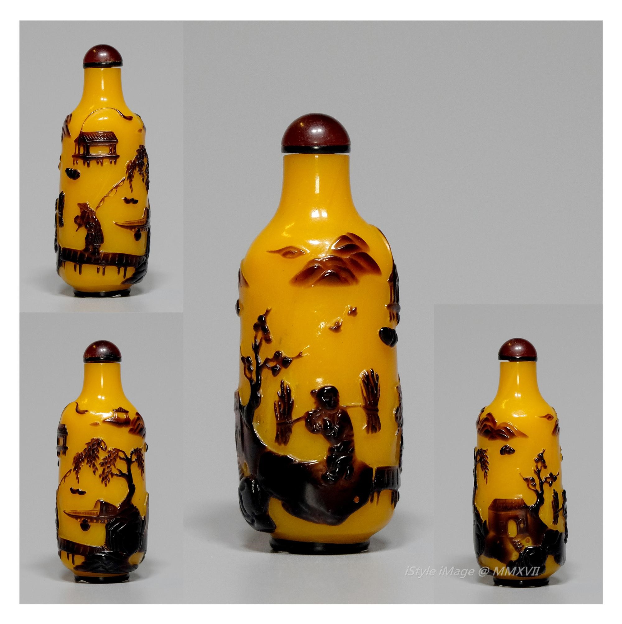 <br><h4>Lot 88 : A very rare shape cream butter yellow glass snuff bottle ( Qing dynasty )</h4>
							This very rare cylindrical body, cleverly to use cream butter yellow ground with intense brown colour overlay decorated a boy carrying 
							his firewood to return home in sunset, background with beautiful river, peaceful clouds, flying birds landscape. With cabochon purple colour glass stopper, spoon missed.
							<br>Measurements (H) high 6 CM, (w)width 2.3 CM<br><br><br>形狀非常罕見的奶油黃色玻璃煙壺 ( 清朝 )<br>這非常罕見的圓柱體，巧妙地使用奶油黃色地與強烈的棕色，重疊裝飾黃昏時份，一個男孩帶著柴火回家，背景襯著美麗的河流，平和的雲彩，飛鳥景觀。 配半圓形紫色玻璃塞，沒有勺子。<br>尺寸(H)高 6 厘米, (W)濶2.3 厘米